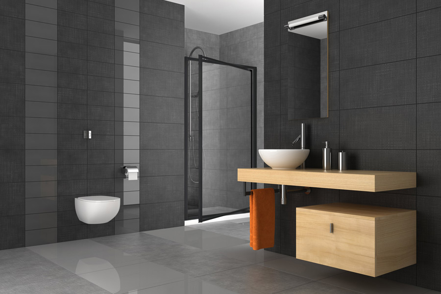 Full Framed black pivot shower screen in charcoal modern bathroom.